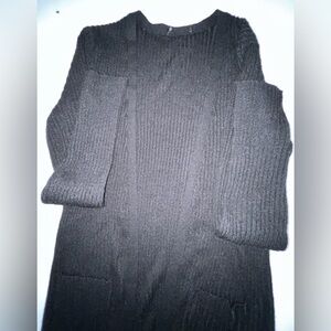 Women’s long Classic Black Cardigan Sweater with pockets. Unknown
